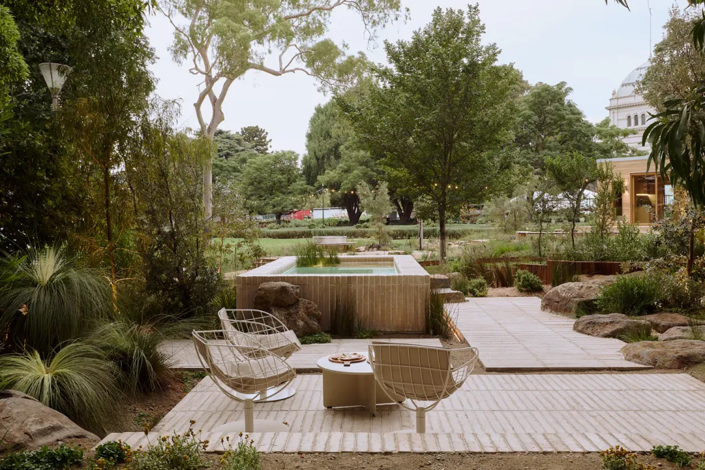Saltbush garden at dusk — gabion walls, native planting and timber platform seating area